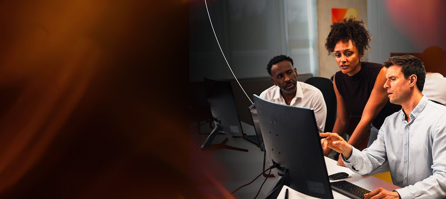 Team reviewing information that's on a computer