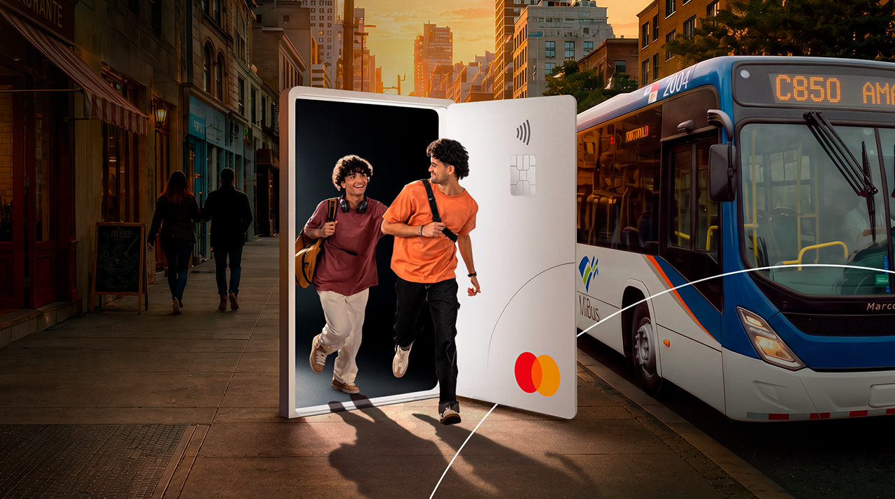 Two smiling people enjoying the benefits of being a Mastercard cardholder.