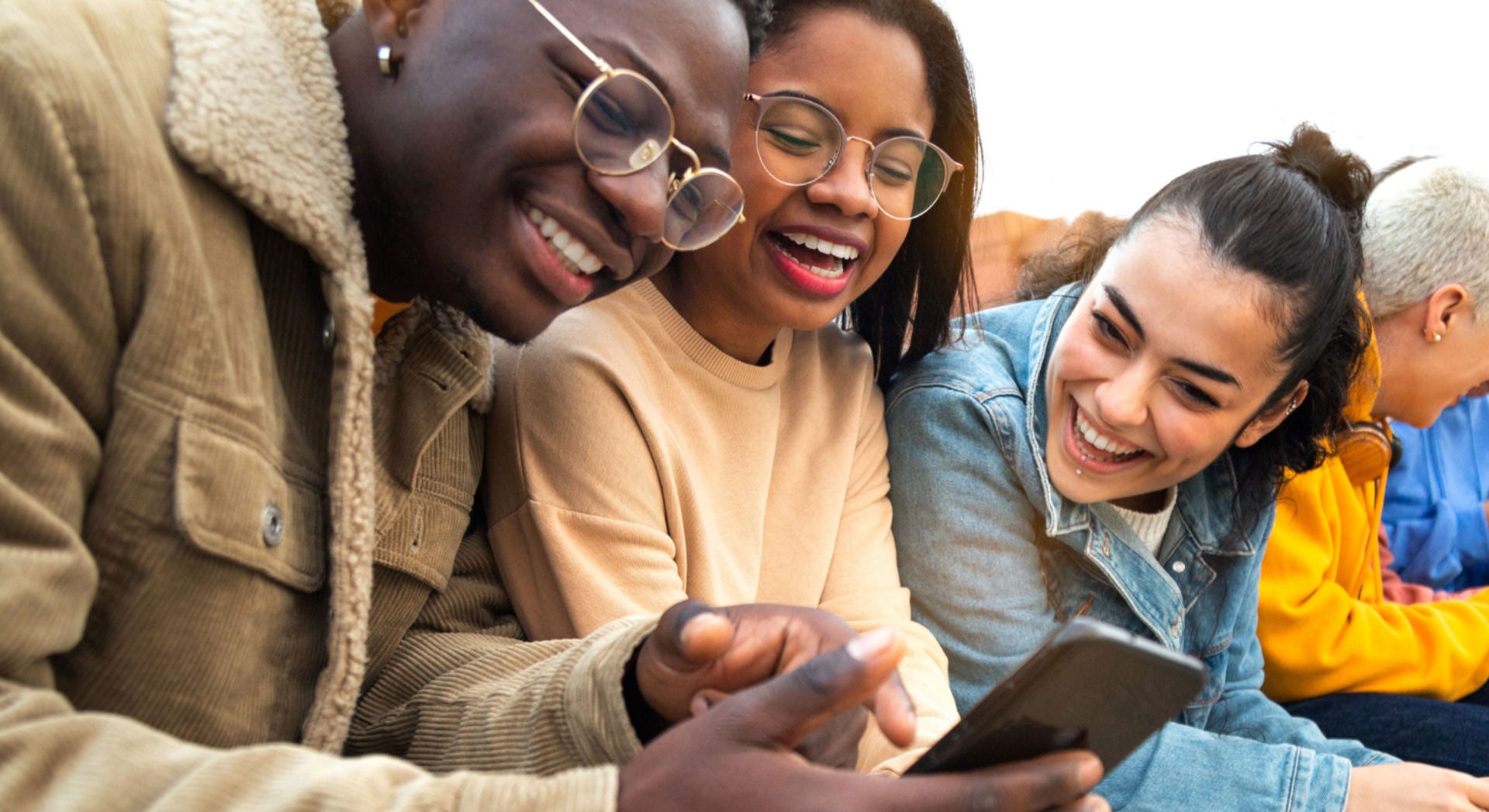 Picture of three peoplle being supported by digital services with their small business in Africa.