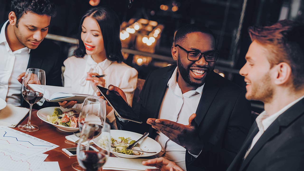 Businessmen having meeting in an indoor restaurant.