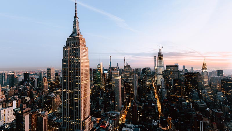 NY city skyline at dusk.