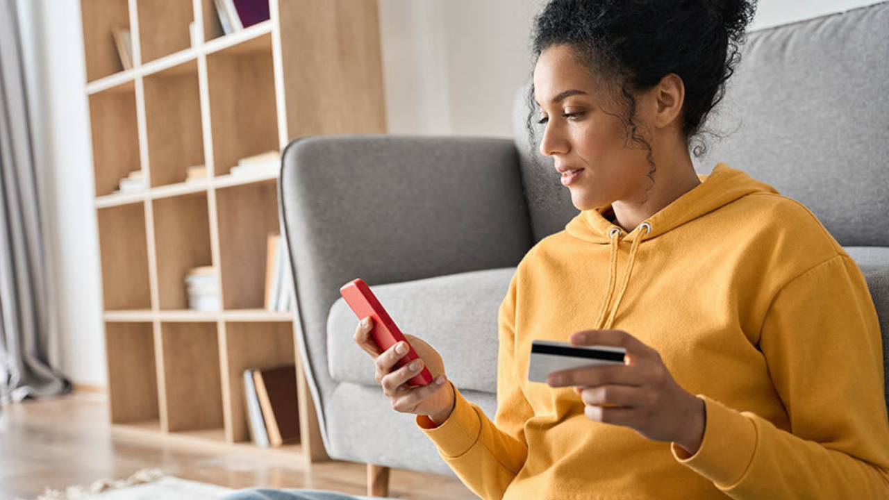 A woman looks at her phone. 