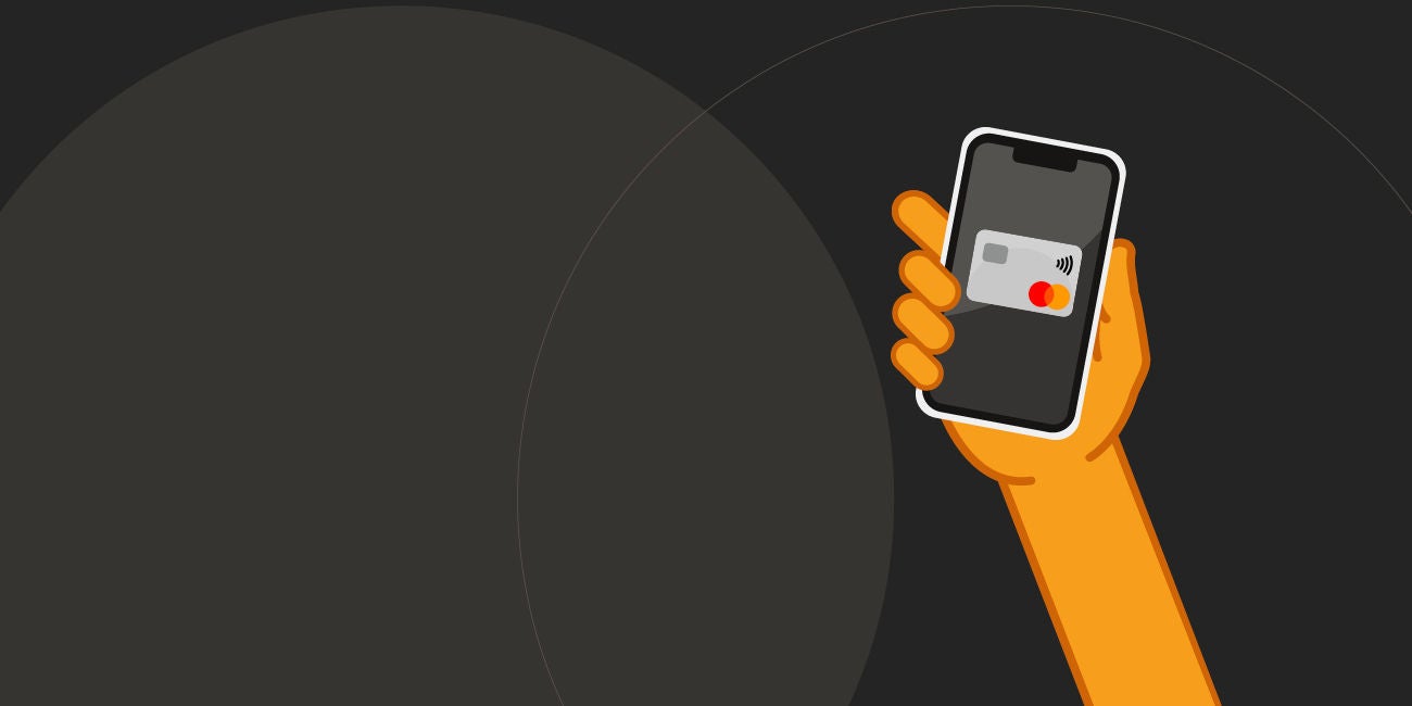 Two smiling people enjoying the benefits of being a Mastercard cardholder.