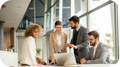 Group of people looking at a laptop together