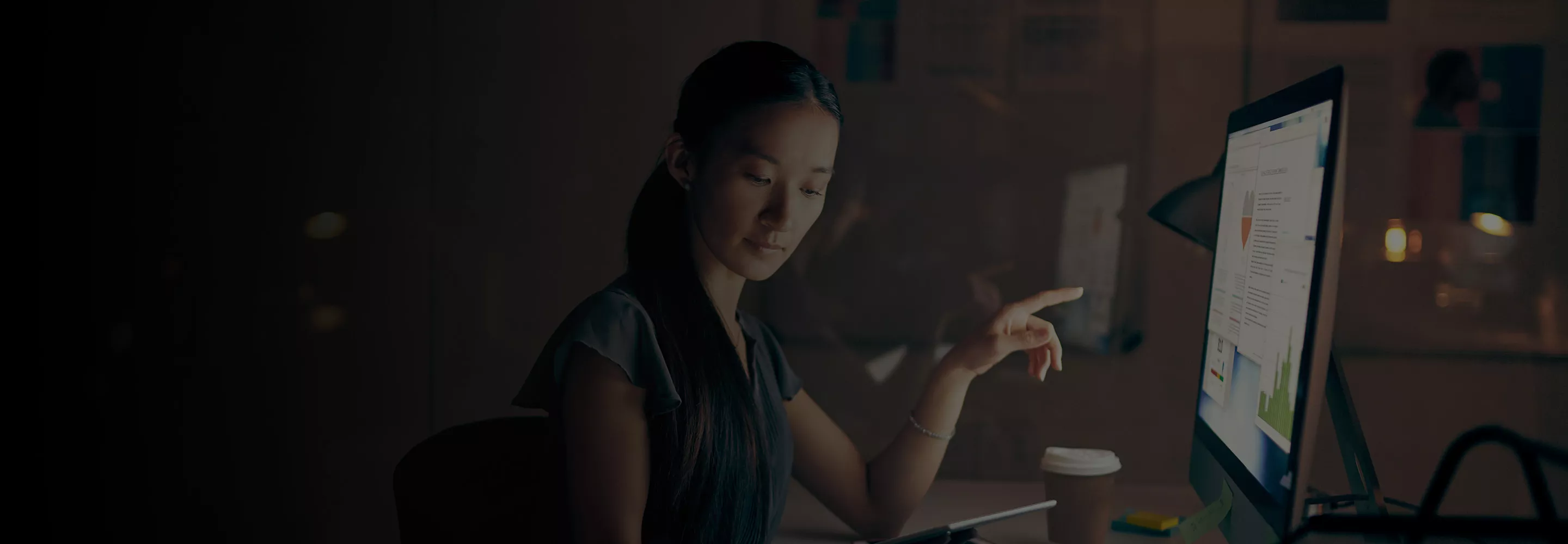 Women at a desk working on computer