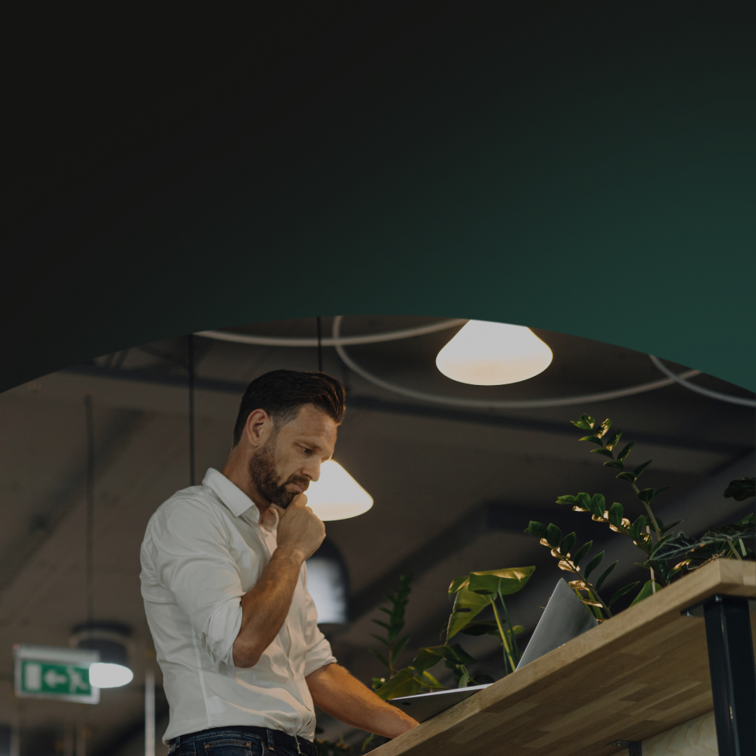 Man in office pondering