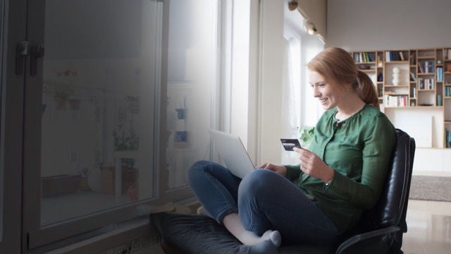 Picture of woman checking laptop for information