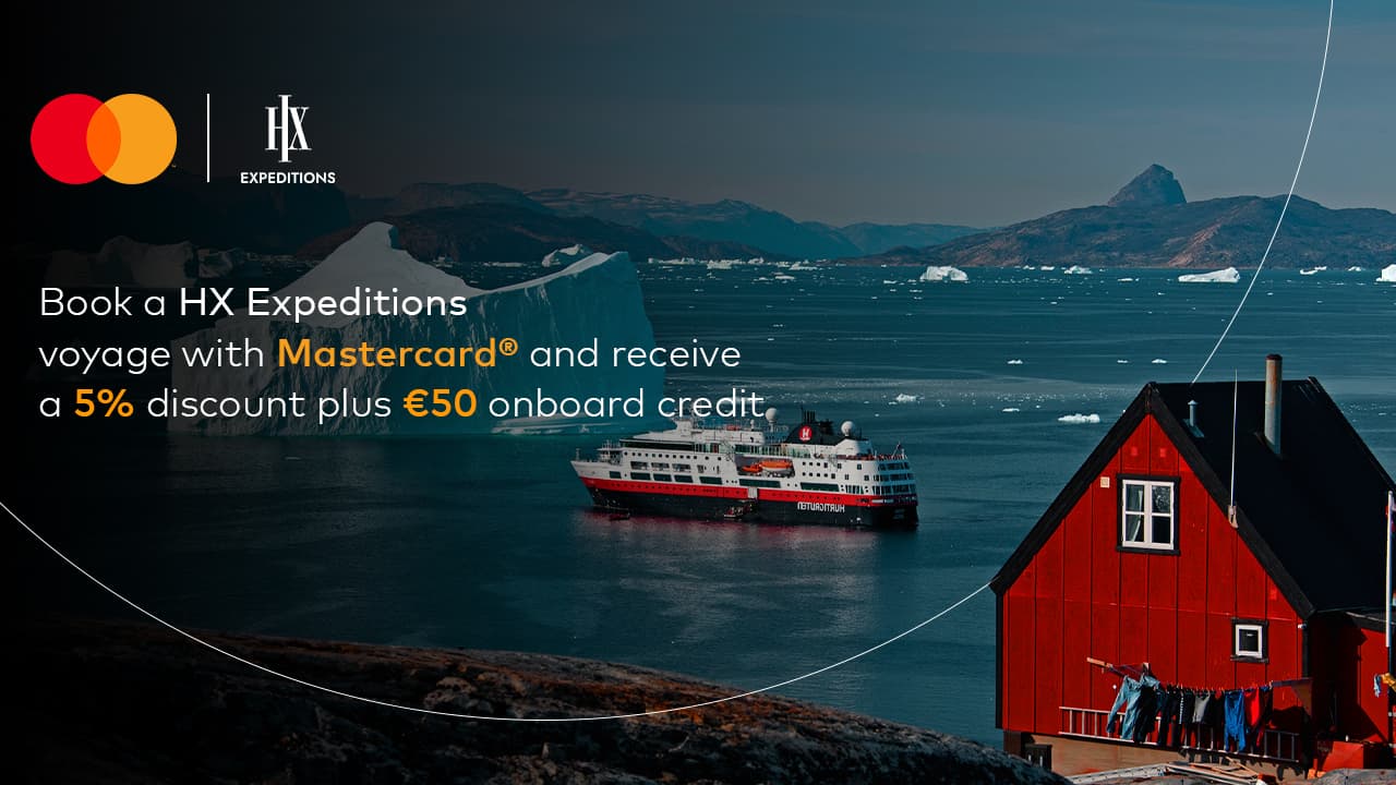 red house among arctic icebergs