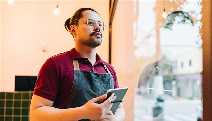 Man stocking and taking ntoes