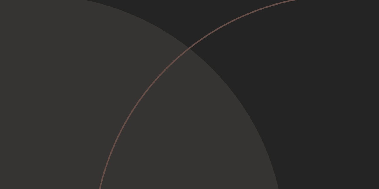 Two smiling people enjoying the benefits of being a Mastercard cardholder.