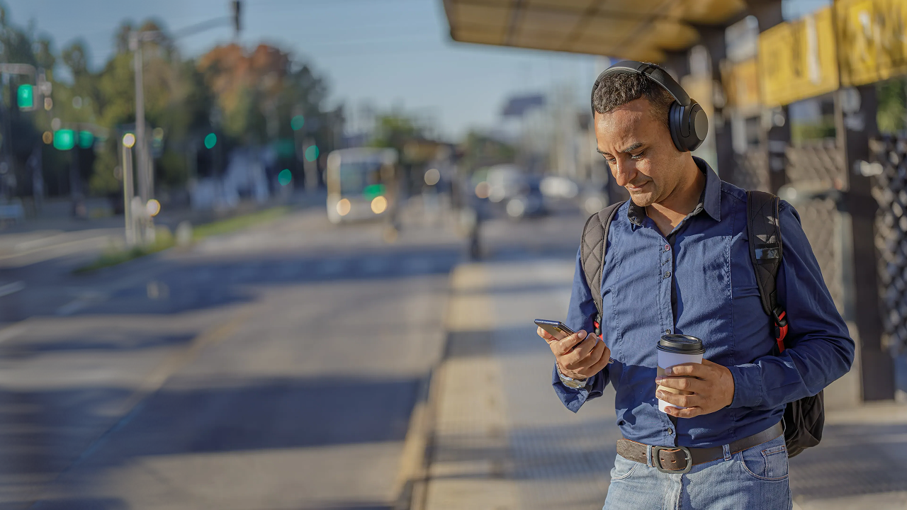 Man with headphones using his phone