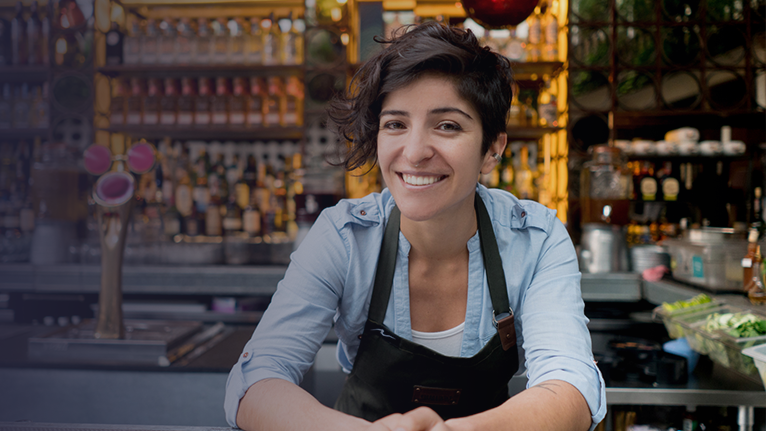 A modern building with multiple windows and a large glass facade.