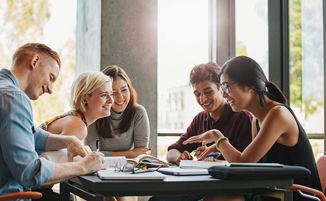 Team collaborating around a table in an office.