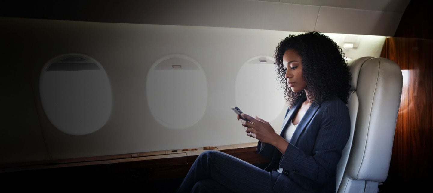 business woman on a private jet