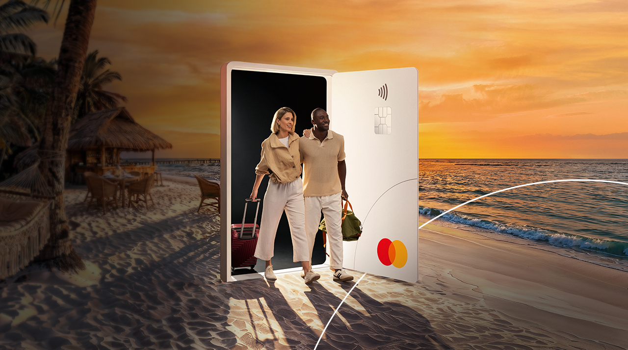 Two smiling people enjoying the benefits of being a Mastercard cardholder.