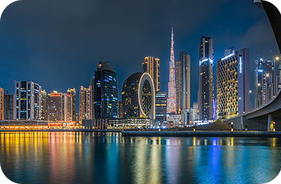 Dubai high-rise builder at night.