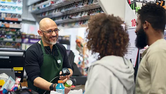 Couple buying at a convenience store