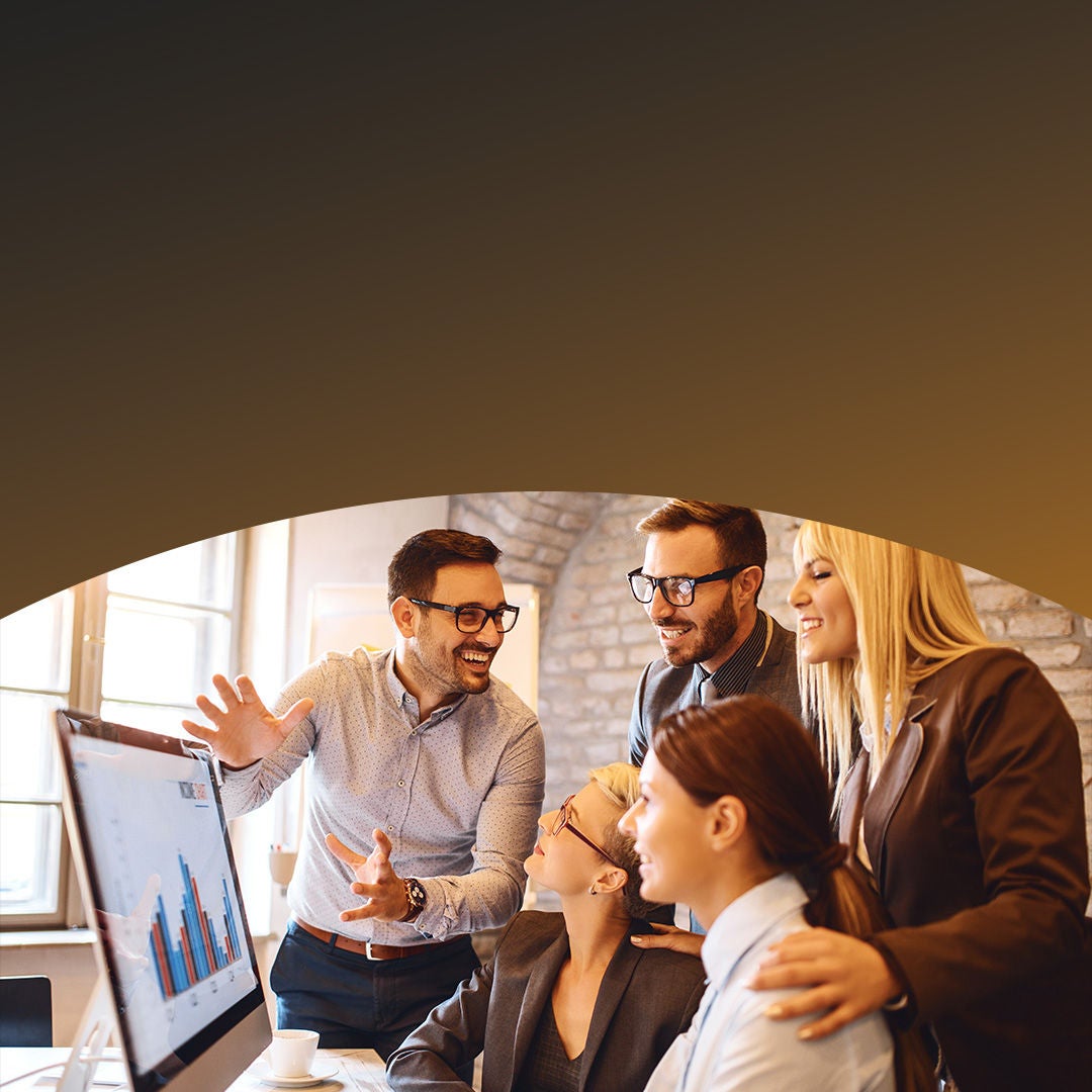 Group of people speaking around computer monitor