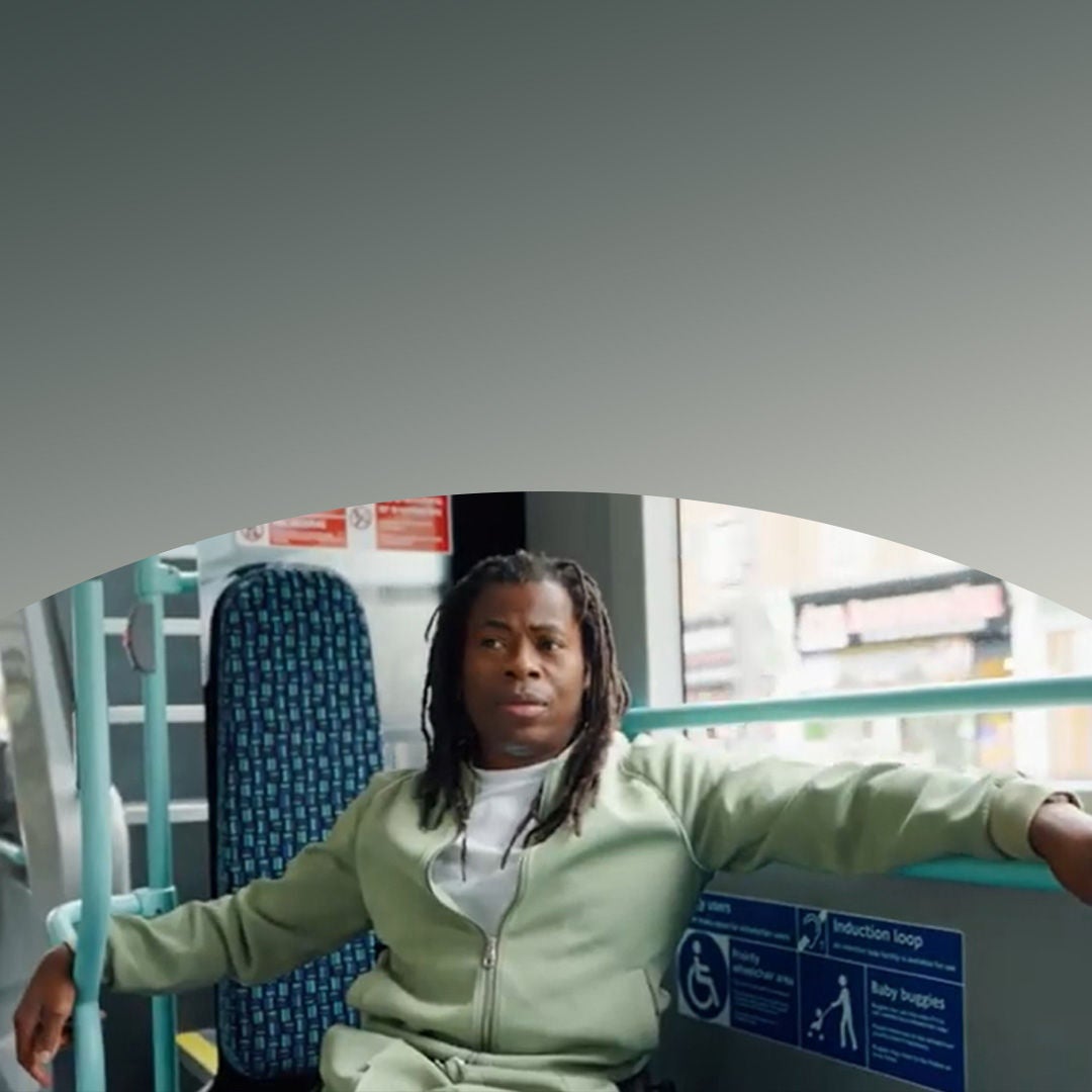 Young man sitting on bus