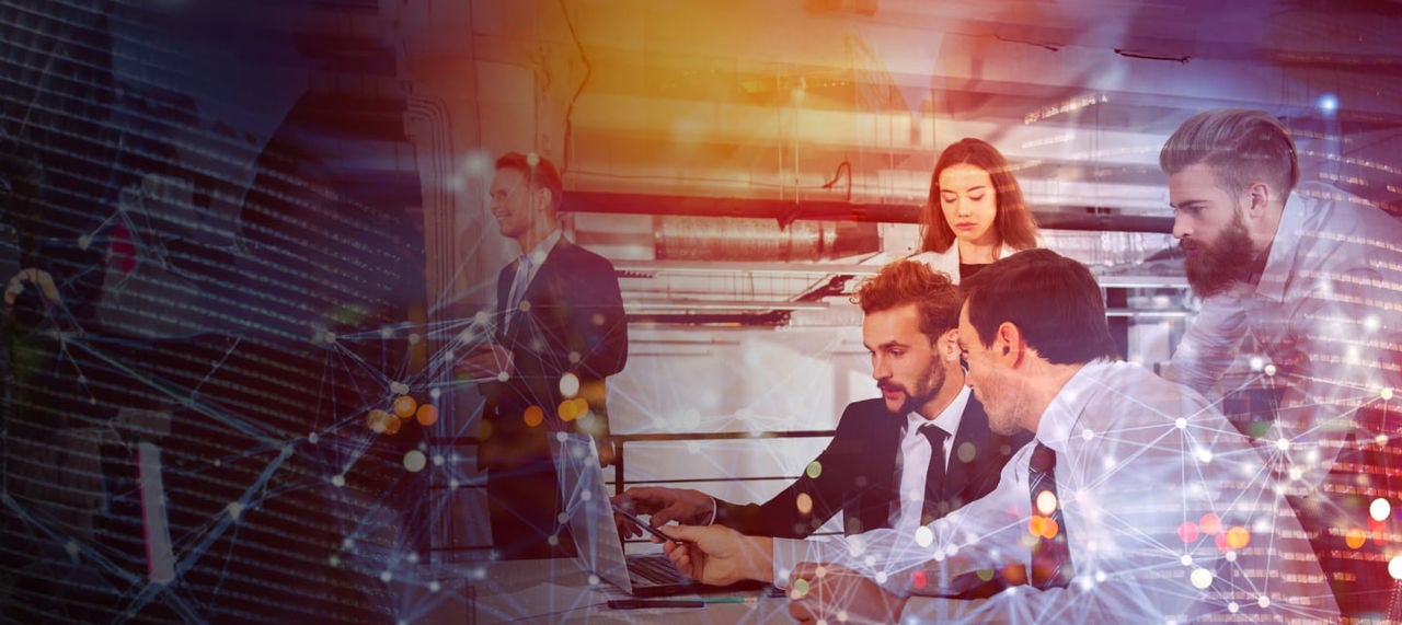 business professionals reviewing financial charts