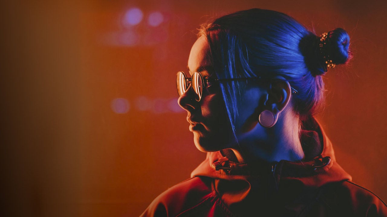 woman wearing glasses neon lighting