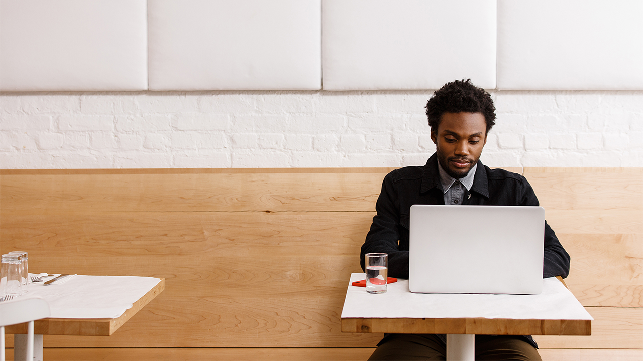 Woman on tablet reviewing credit documents