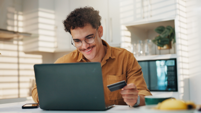Man on computer smiling