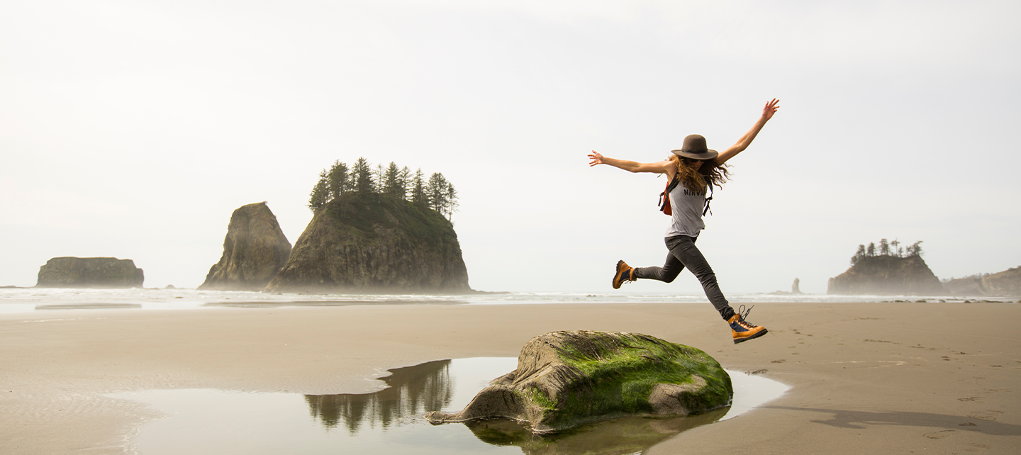 Person jumping in the beach