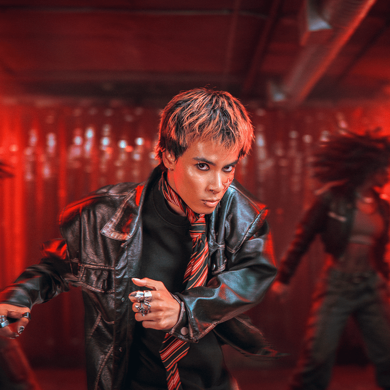 dancer in red lit room