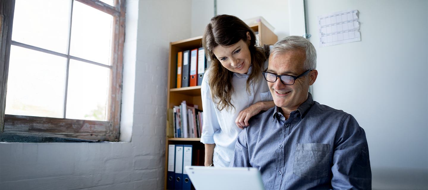 Couple making an online purchase at home