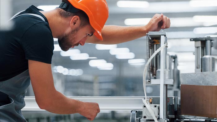 Man working with machinery.