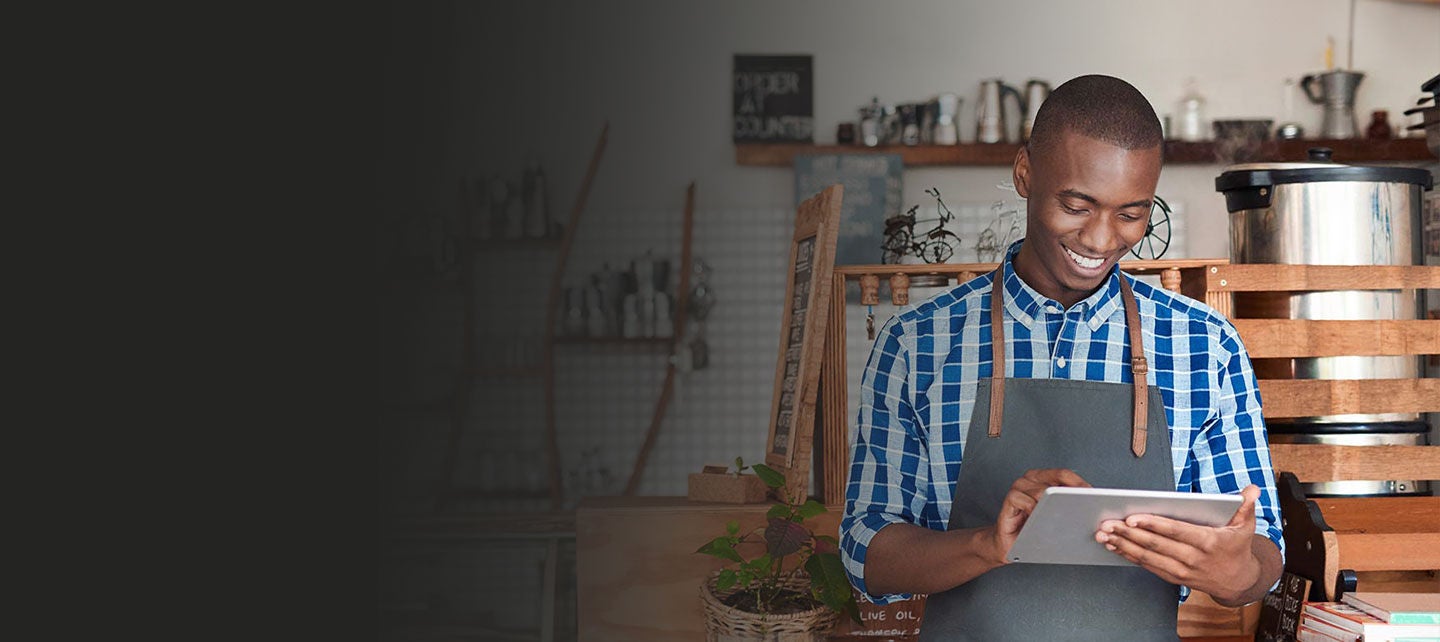 Small business owner calculating profit.