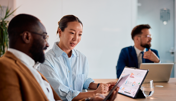 Coworkers looking over data in the office