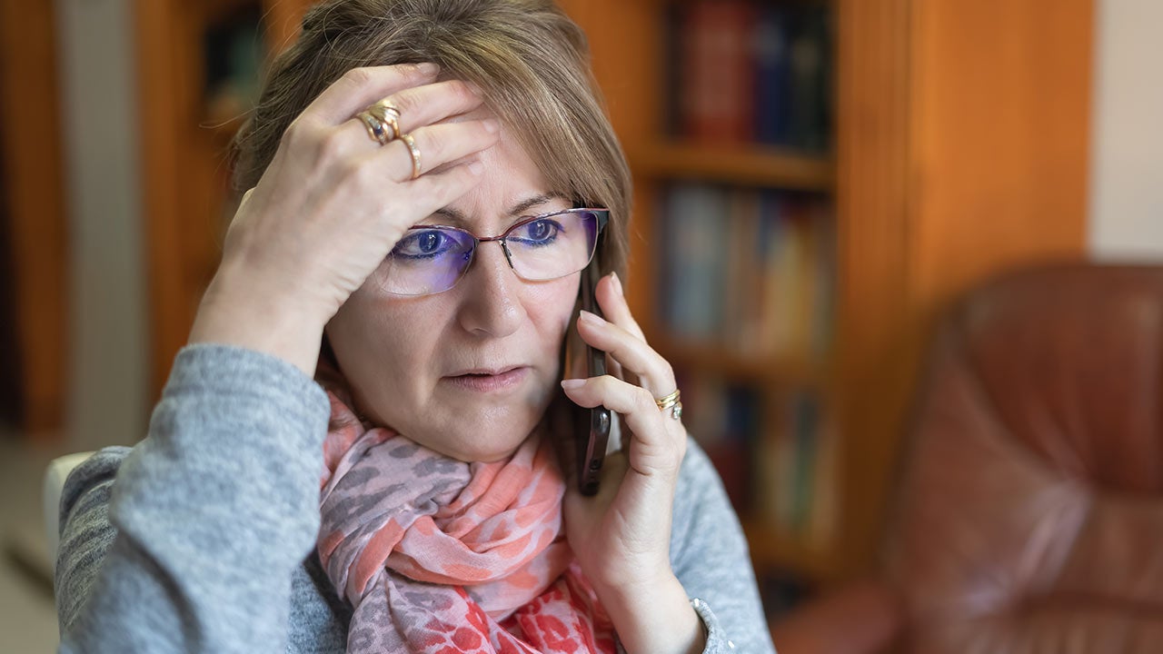 Worried looking mother on phone.