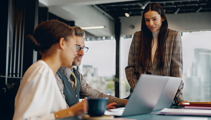 Coworkers looking over data in the office