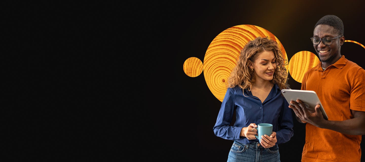 Happy business casual man and woman with a tablet