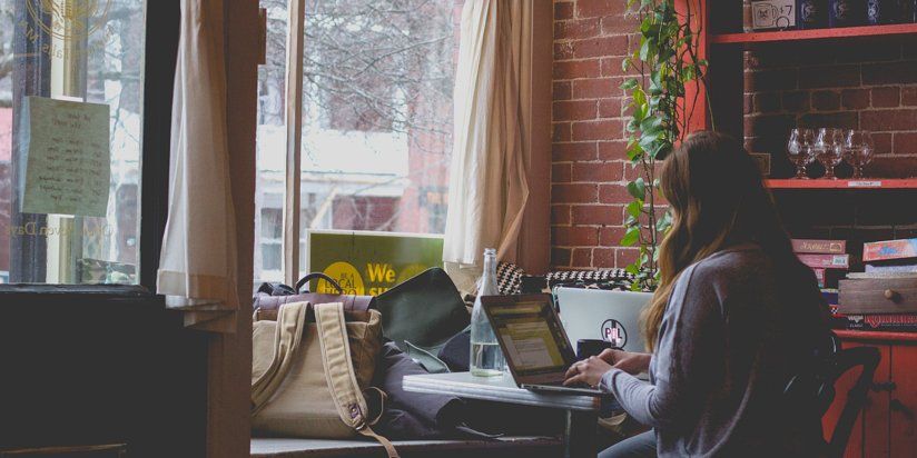 Woman working from home in front of the window