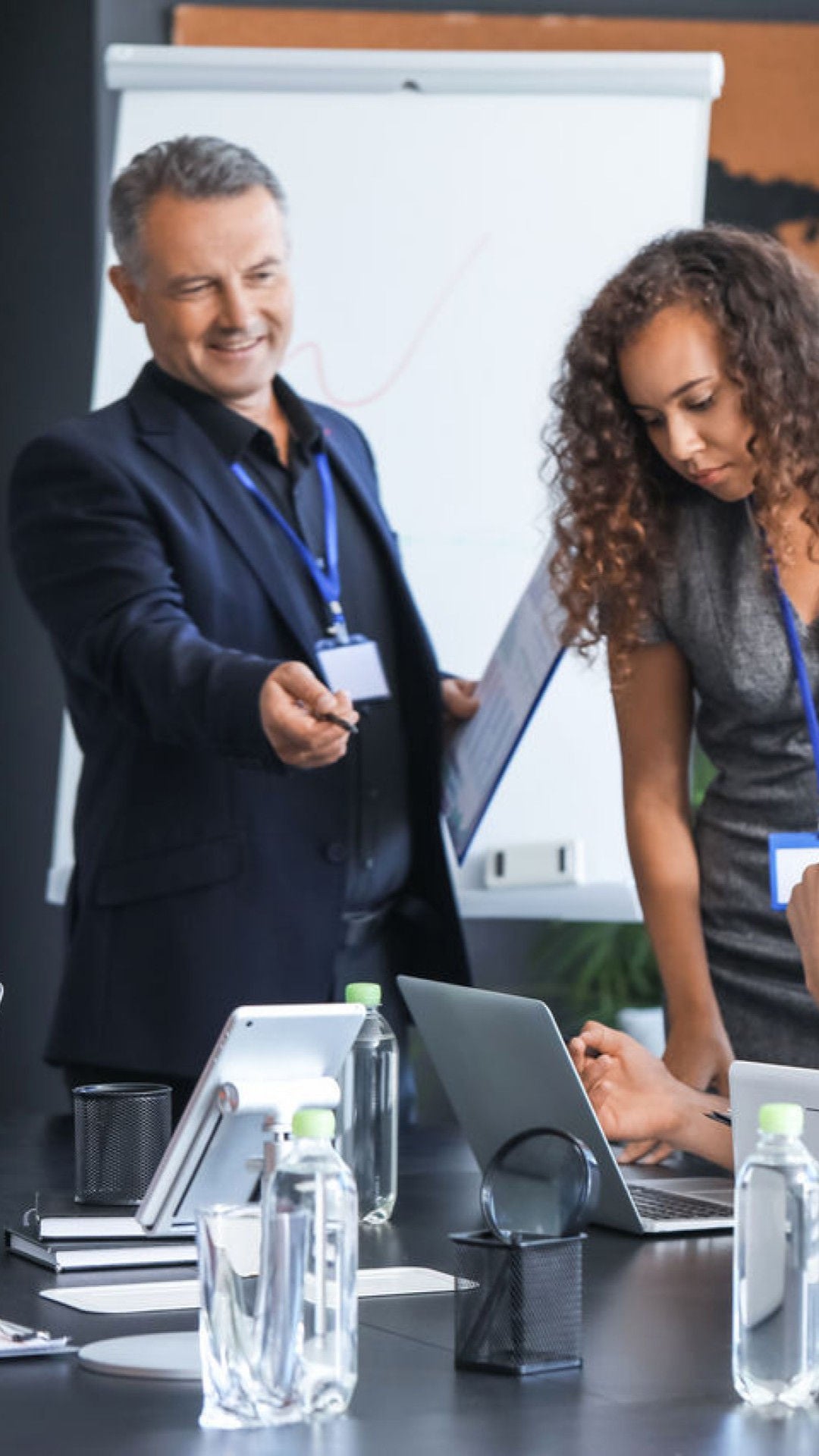 Man advising woman and team