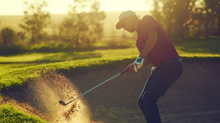 Man playing golf