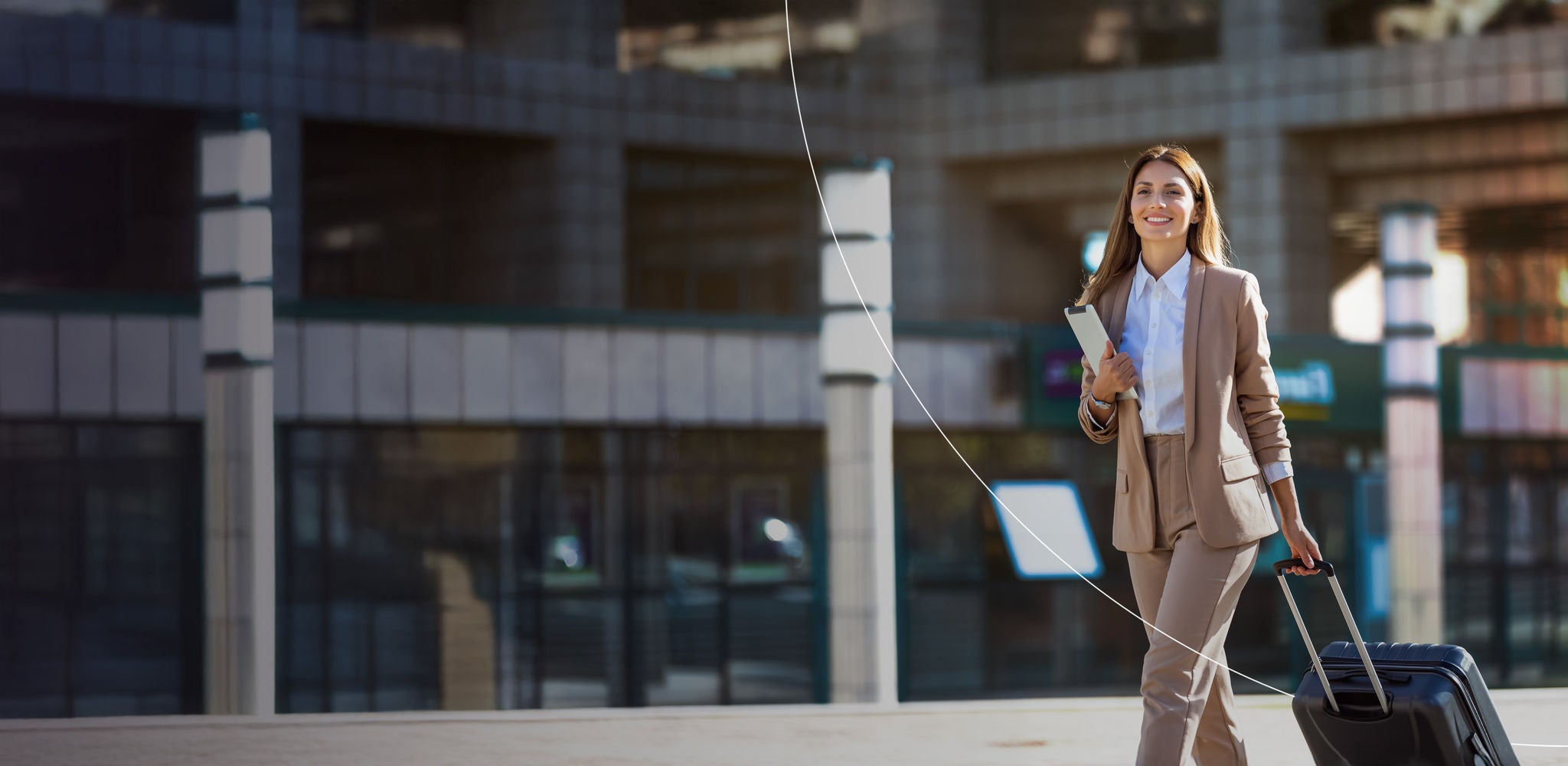 Femail business traveler with smile on her face due to streamlining wholesale travel issues.