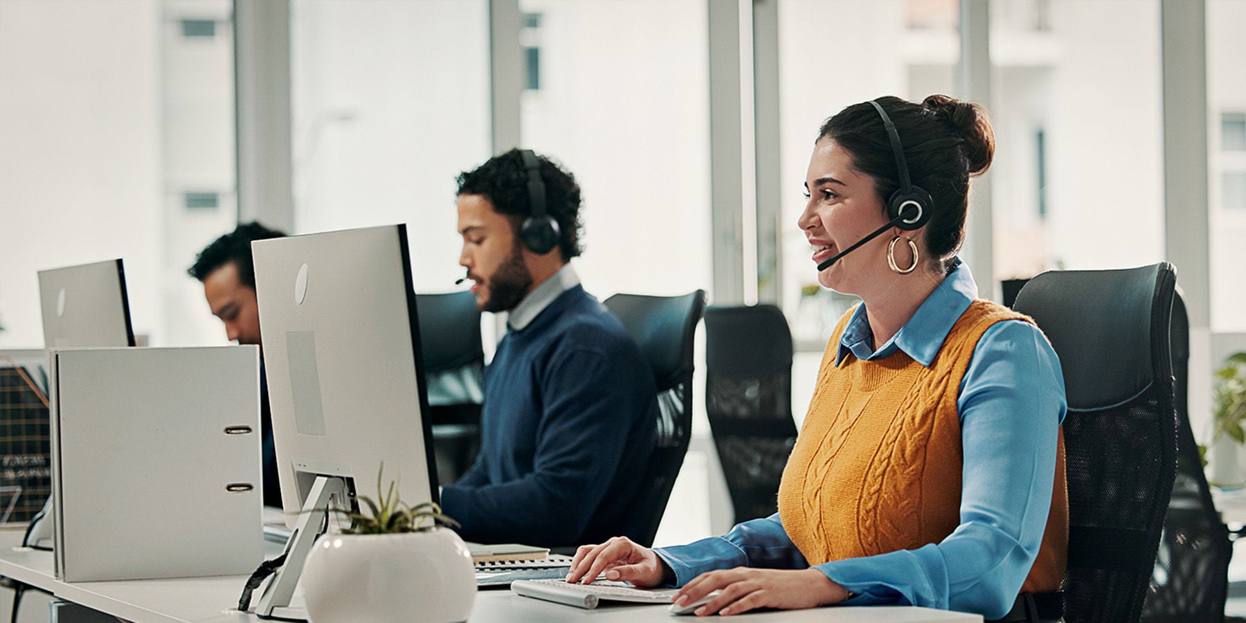 Woman in customer success answering a call