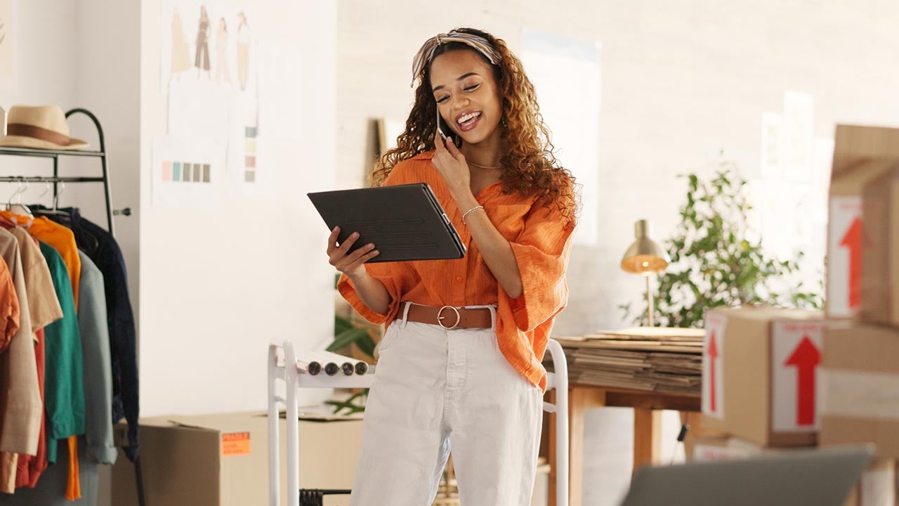 Small business owner with devices.