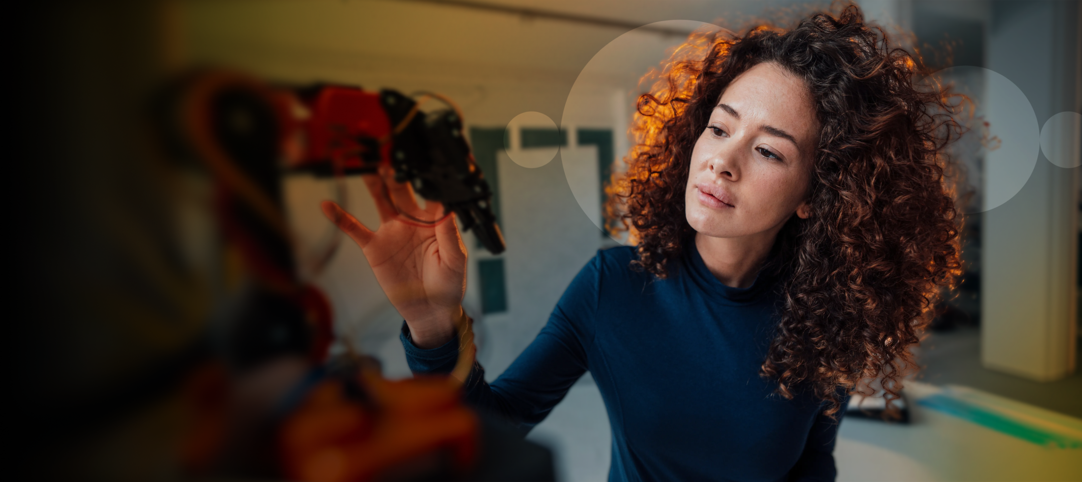Woman looking over robotics in the office