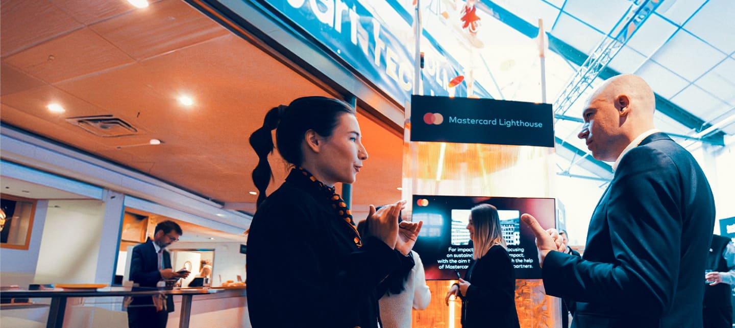 people networking at business conference booth