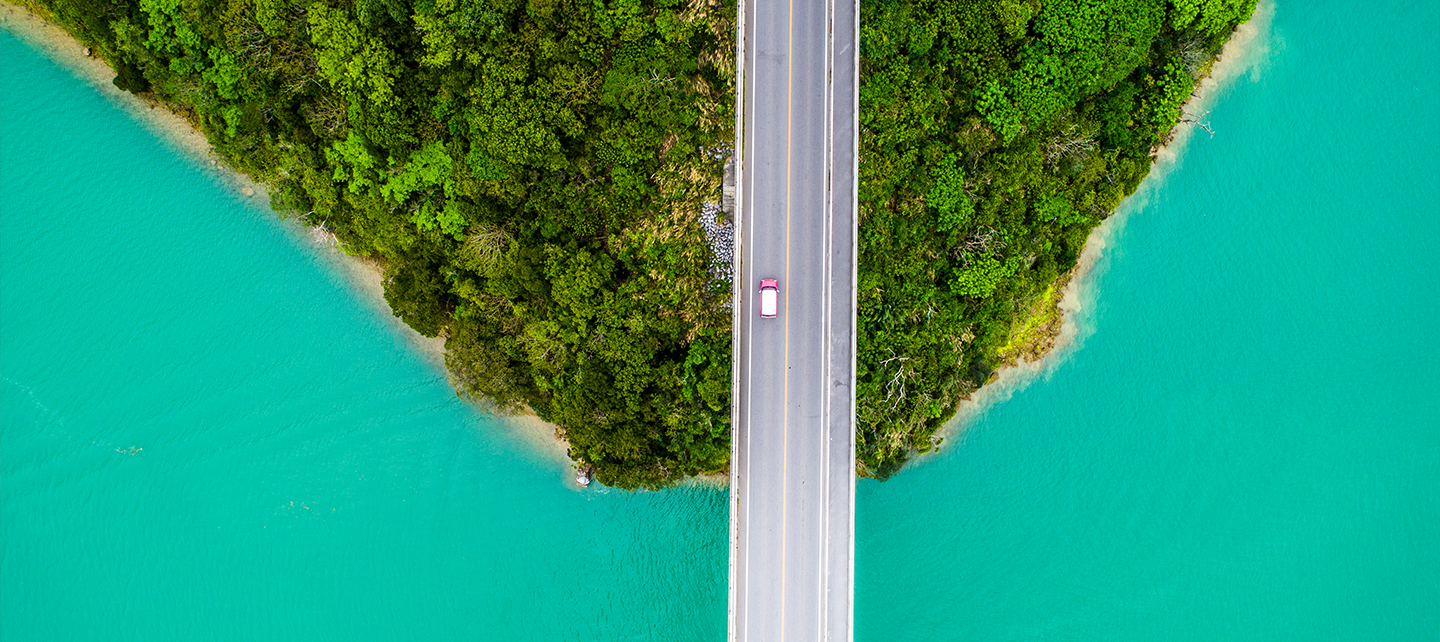 Aerial image of a road going into the ocean