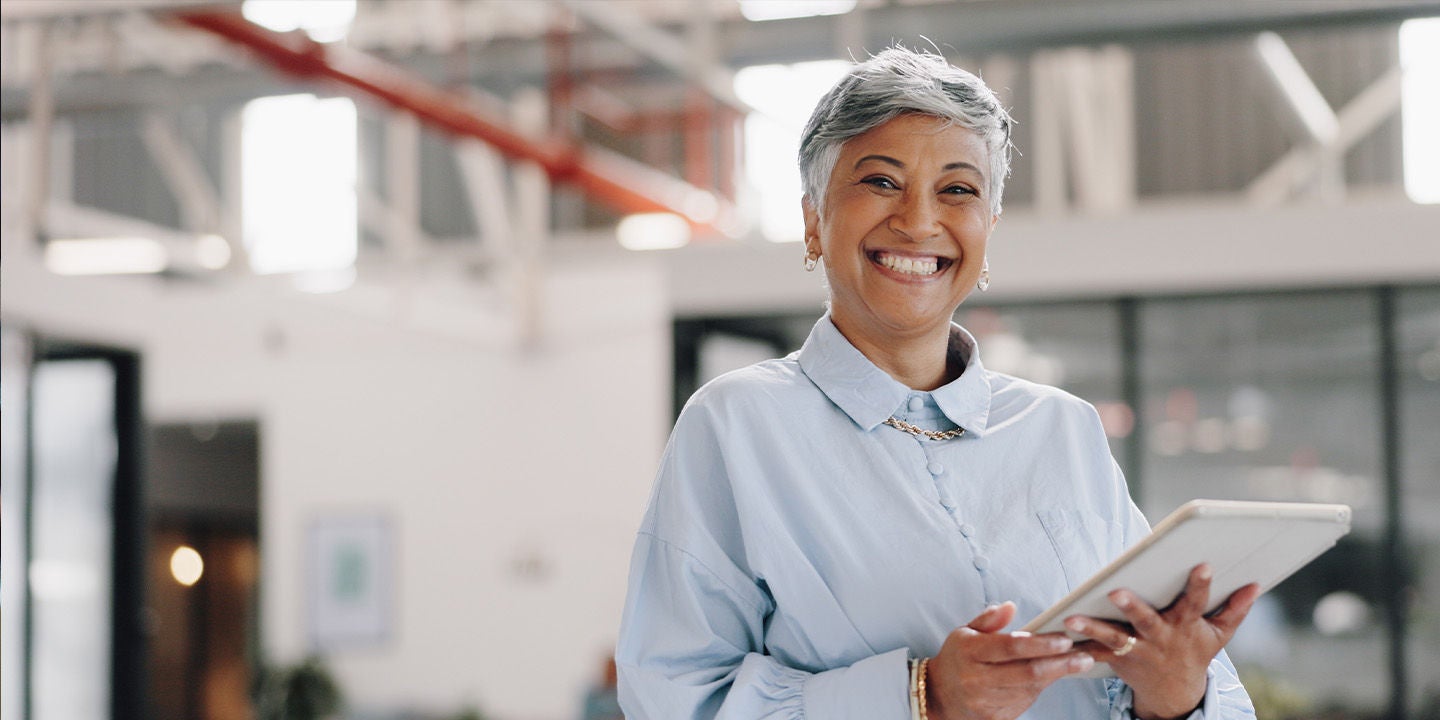 Woman in a blue shirt working at the office