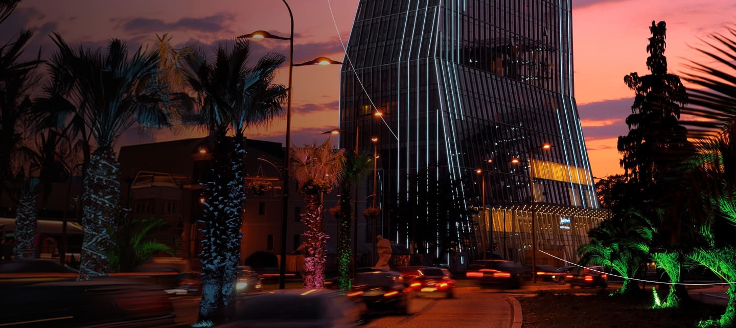 slender modern skyscraper at dusk