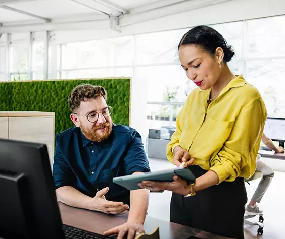 Man and woman looking at tablet