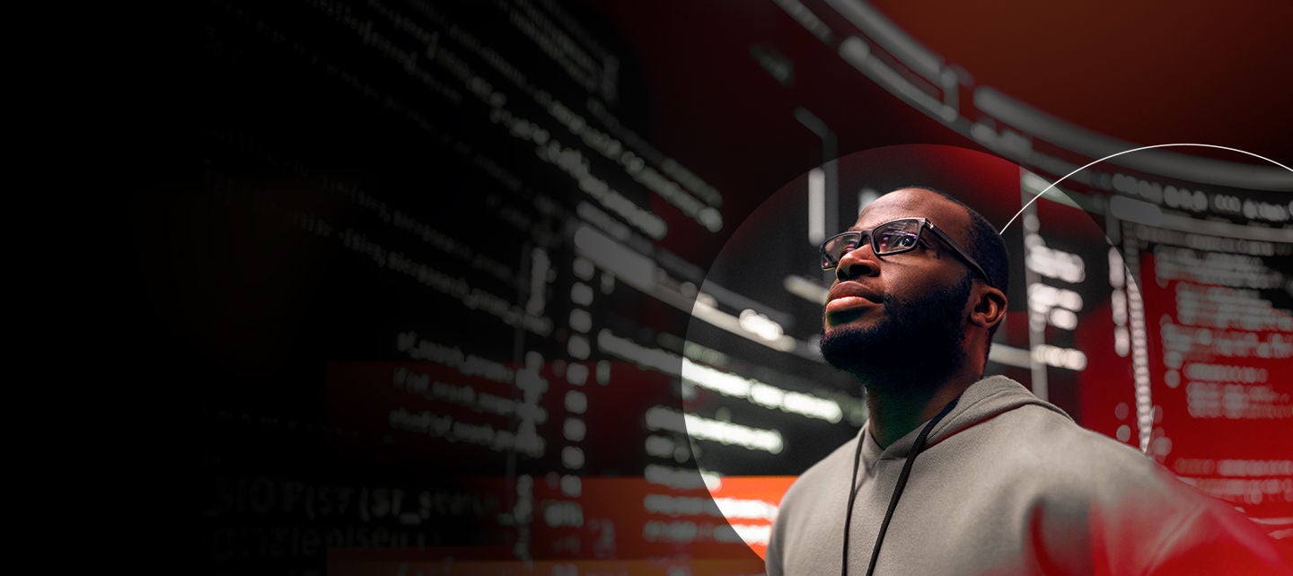 Man looking away with technology around him