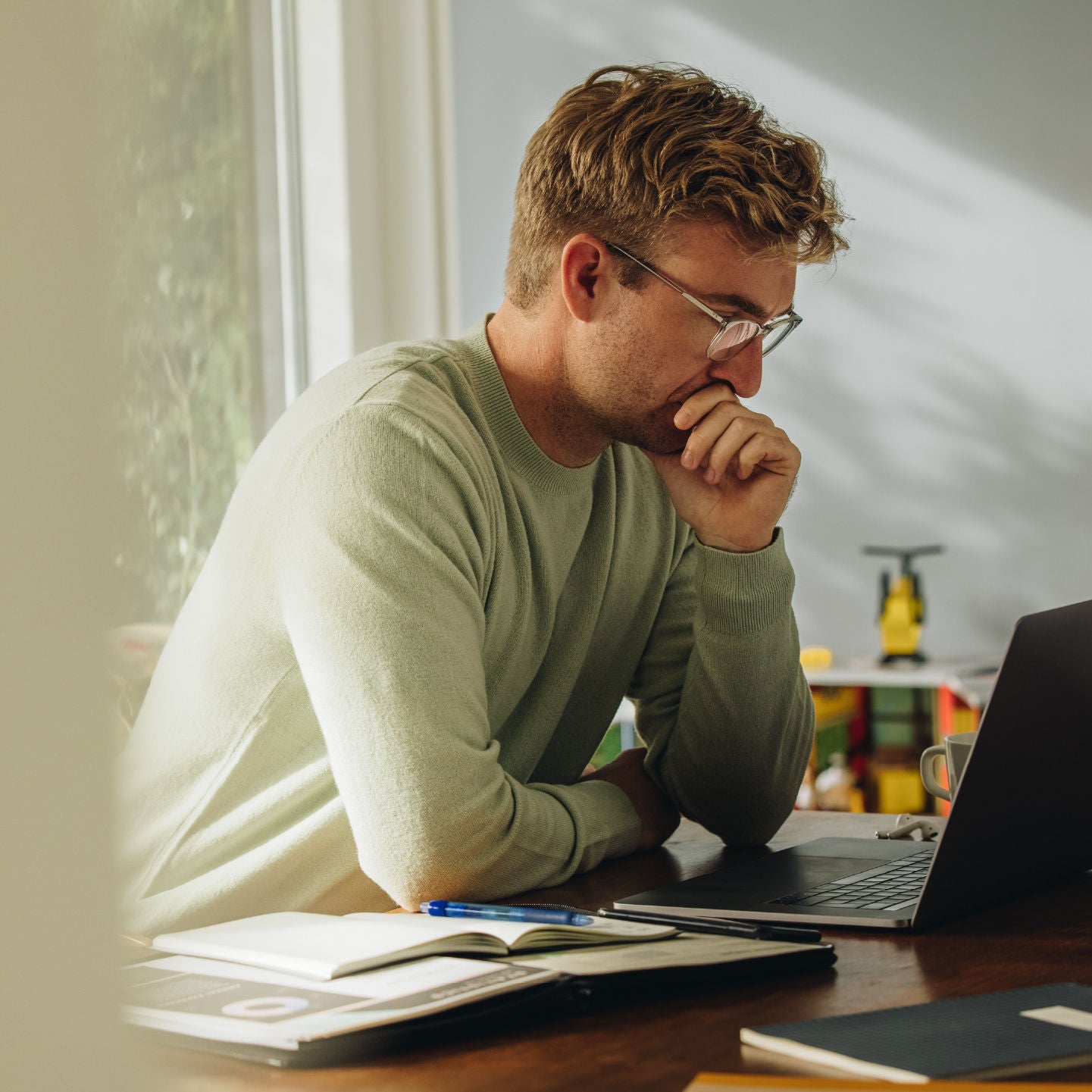 Man sitting at a desk and studying